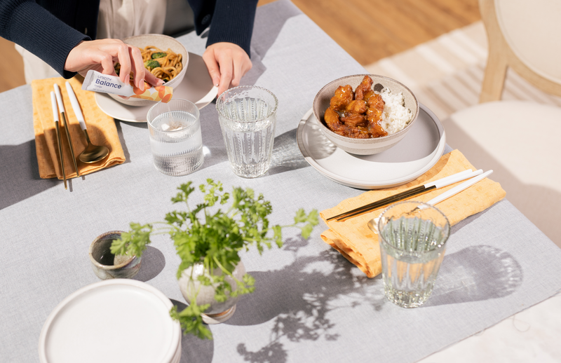 Unicity Balance bottle and Unimate sachet product shot